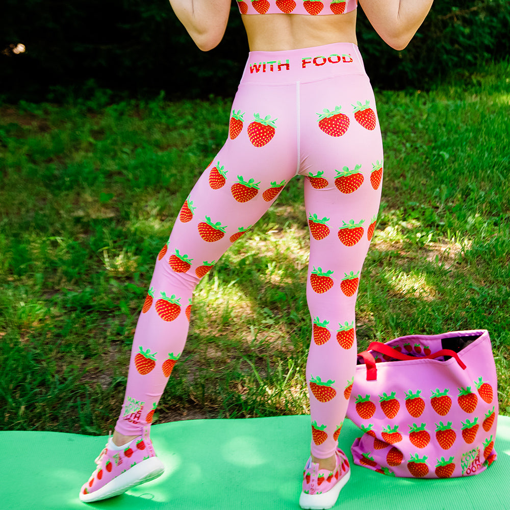 http://www.makelovewithfood.com/cdn/shop/products/pink_strawberry_yoga_leggings_on_woman_by_make_love_with_food_1200x1200.jpg?v=1560645996